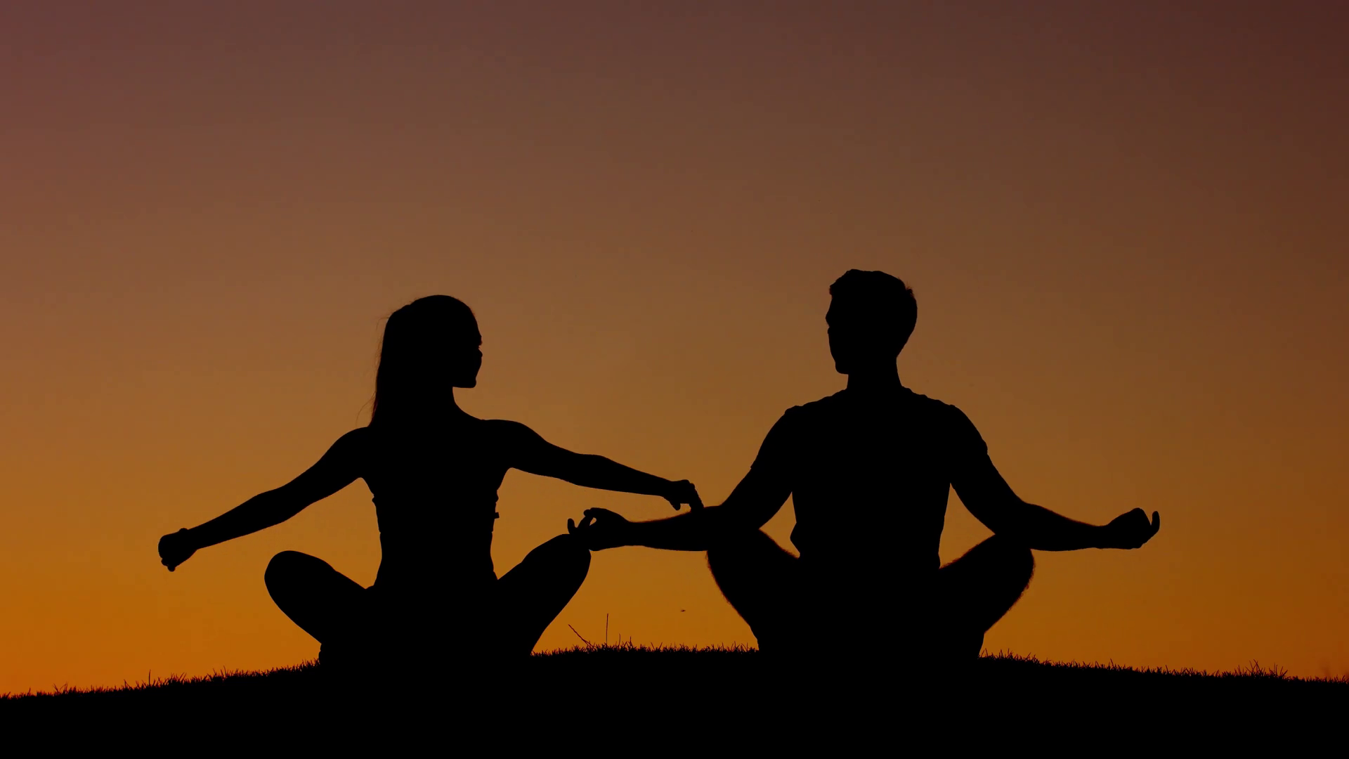 boy-and-girl-engage-in-yoga-on-the-nature-a-man-and-a-woman-meditating-in-the-mountains-people-relax-at-sunset_hkmosmfrx_thumbnail-full01